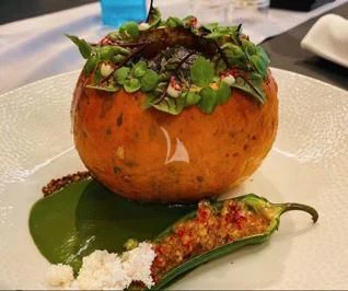 a pumpkin with a face carved on it aboard 888 Yacht for Sale