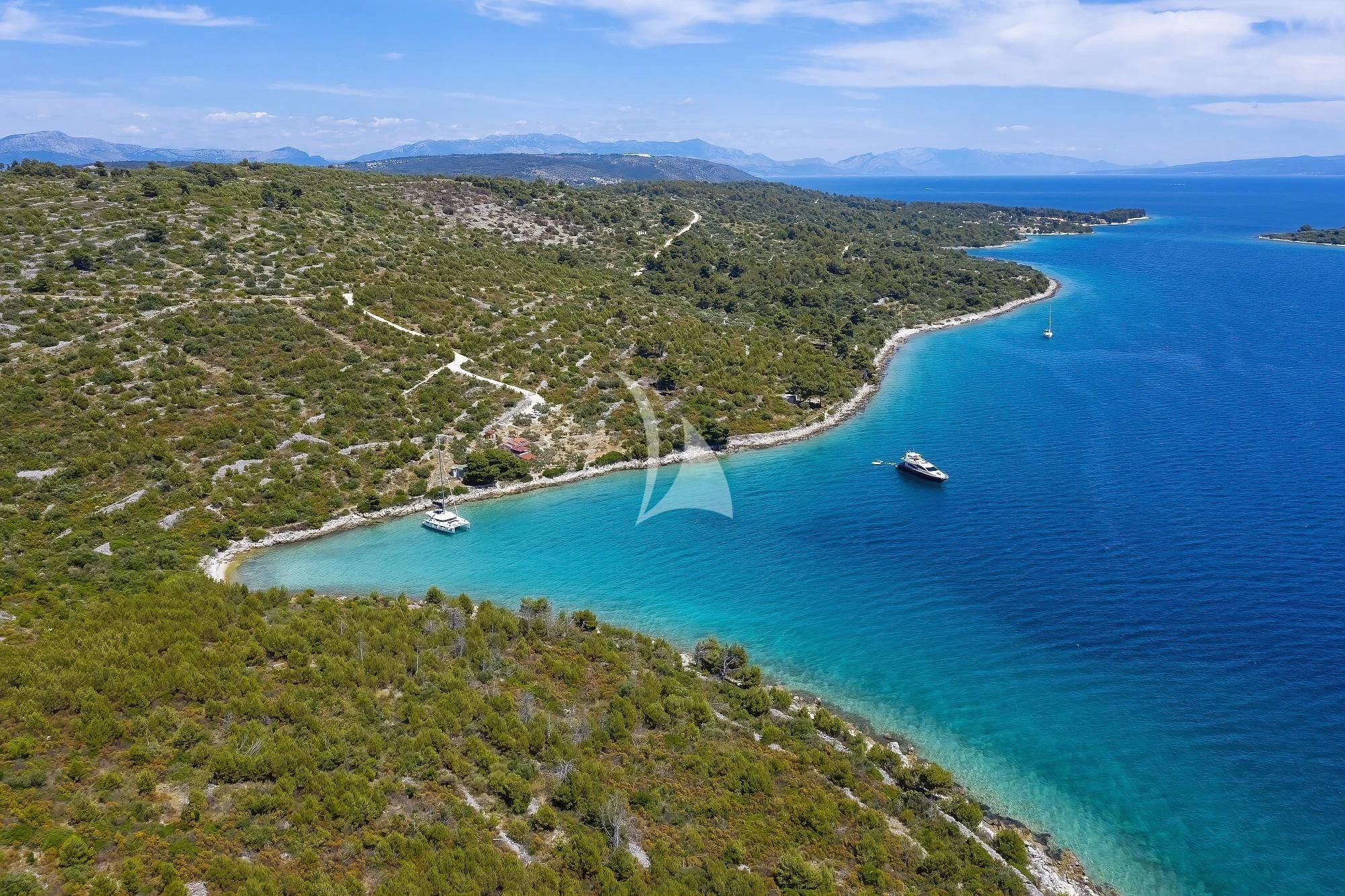 a body of water with land around it and boats on it aboard 888 Yacht for Sale
