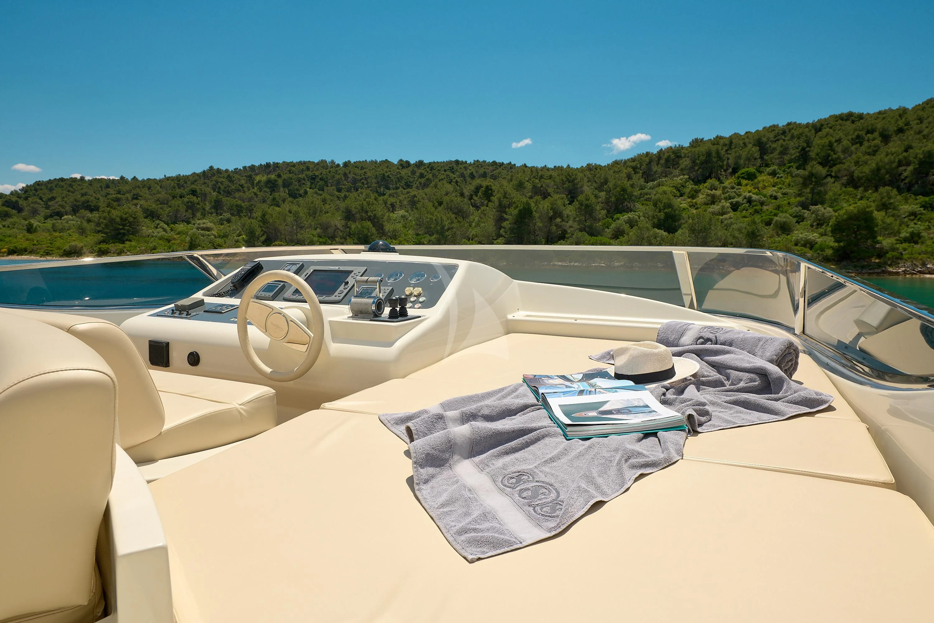 a white car with a blue tarp on it aboard 888 Yacht for Sale