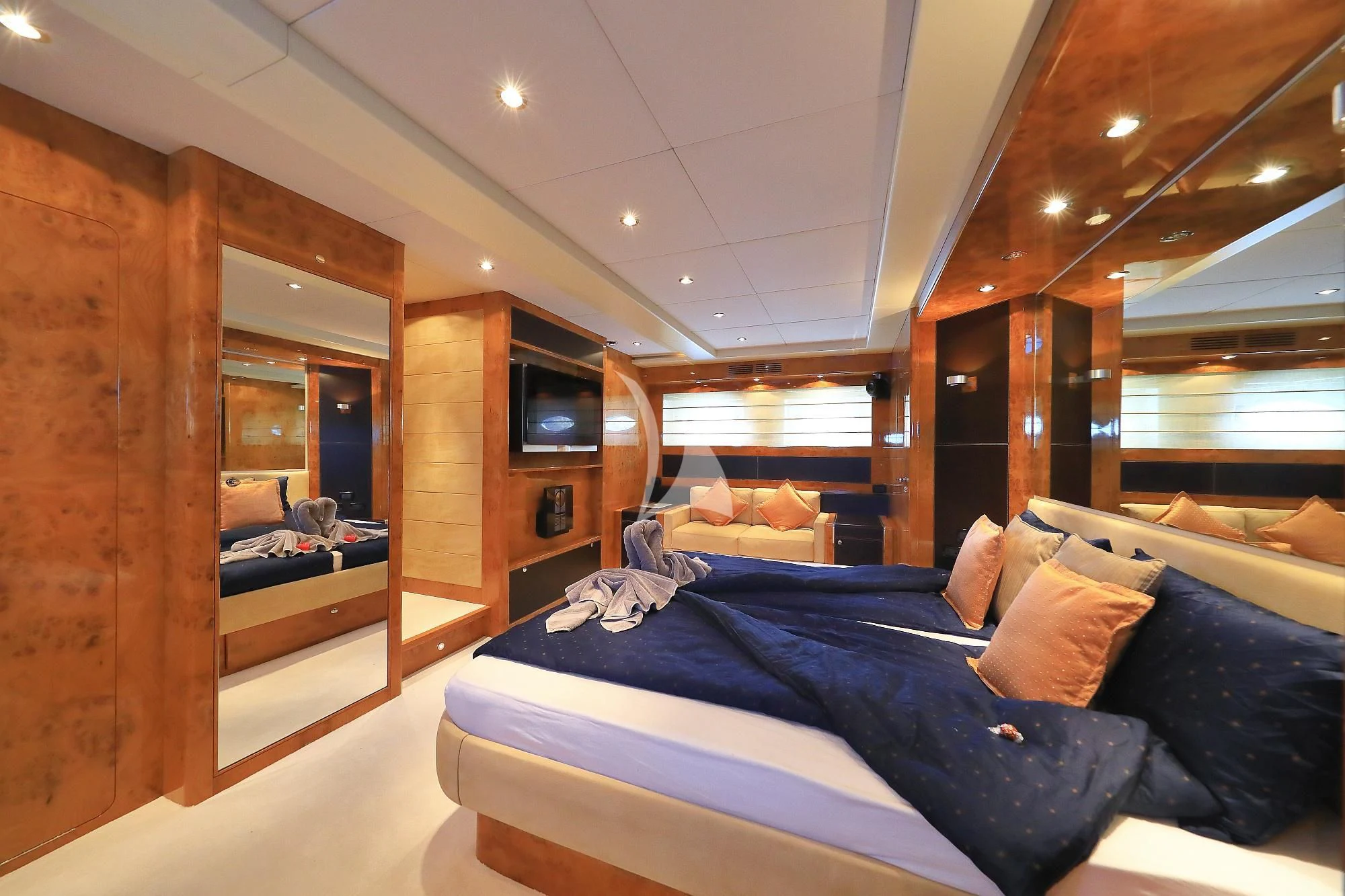 a bedroom with a bed and a wood wall aboard 888 Yacht for Sale