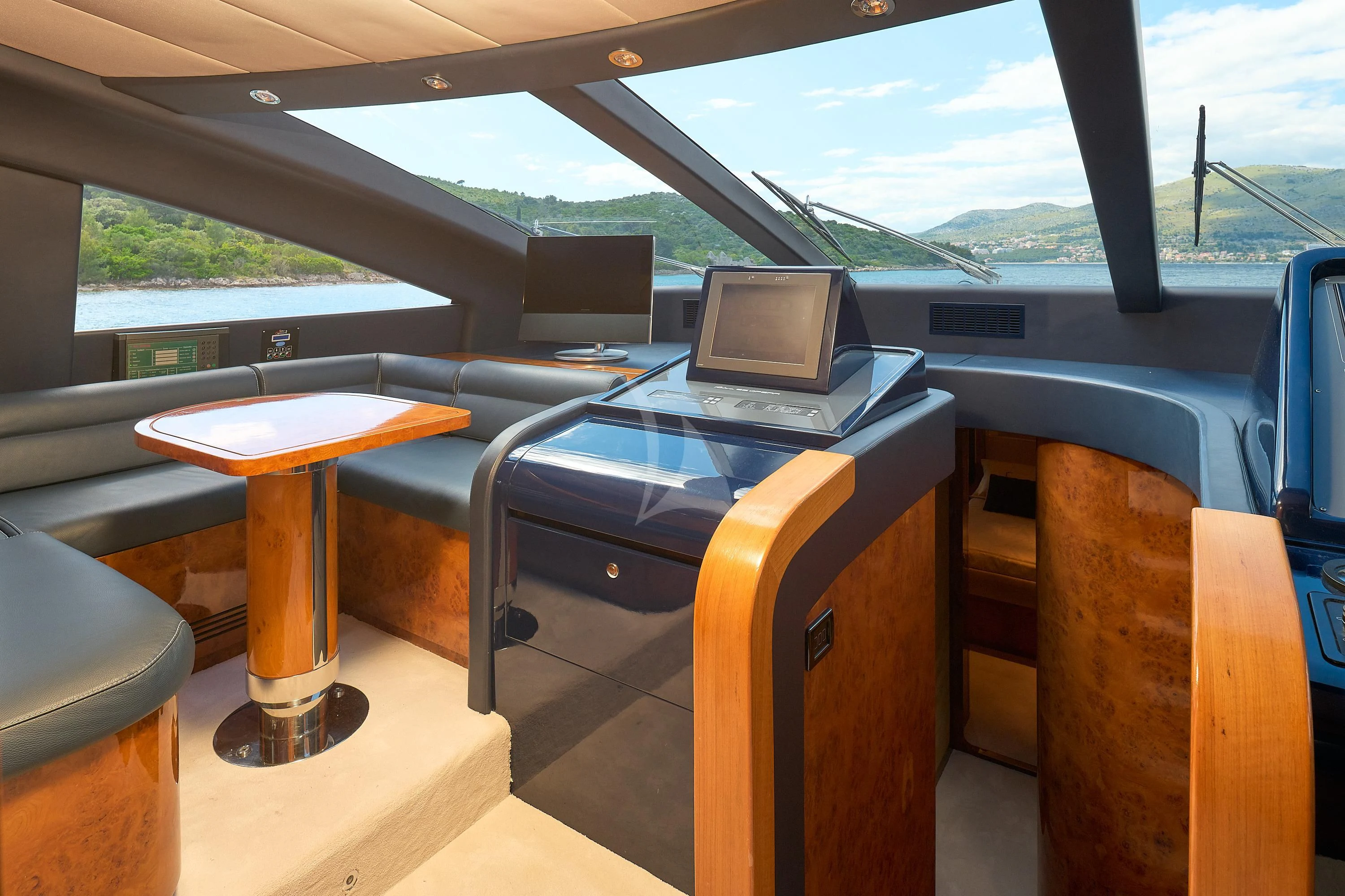 a car with a laptop on the seat aboard 888 Yacht for Sale