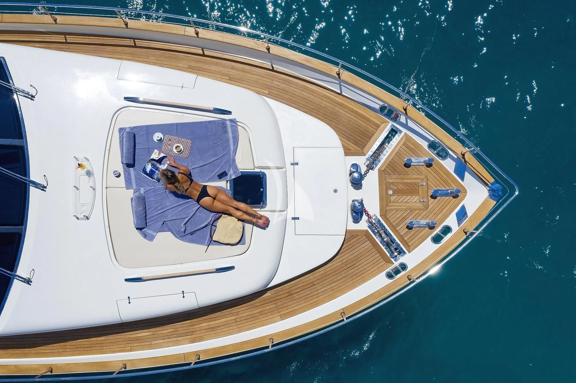 a person sitting on a plane aboard 888 Yacht for Sale