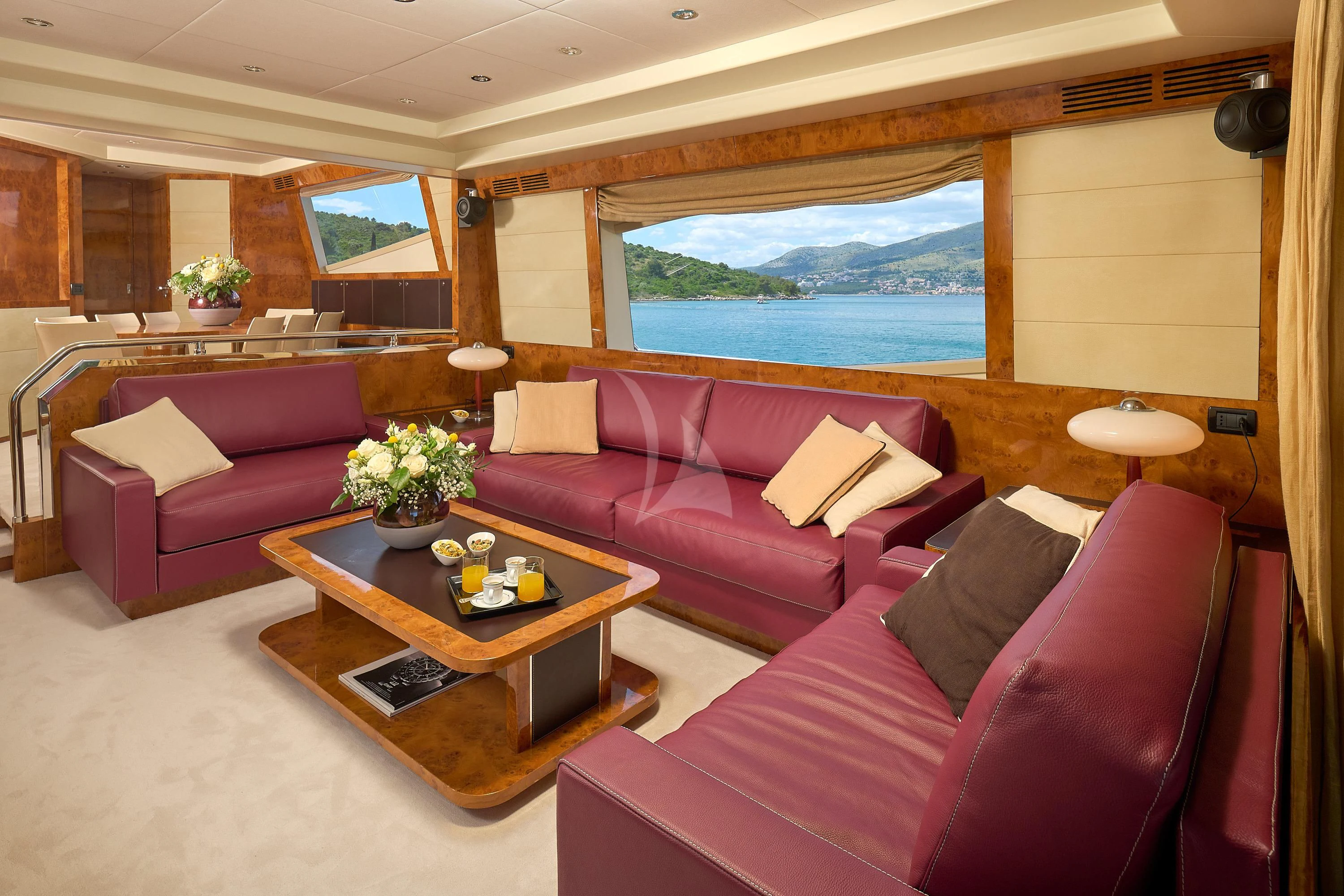 a living room with a couch and a coffee table aboard 888 Yacht for Sale