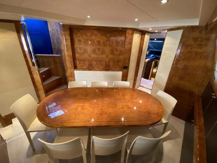 a table with chairs around it aboard 888 Yacht for Sale