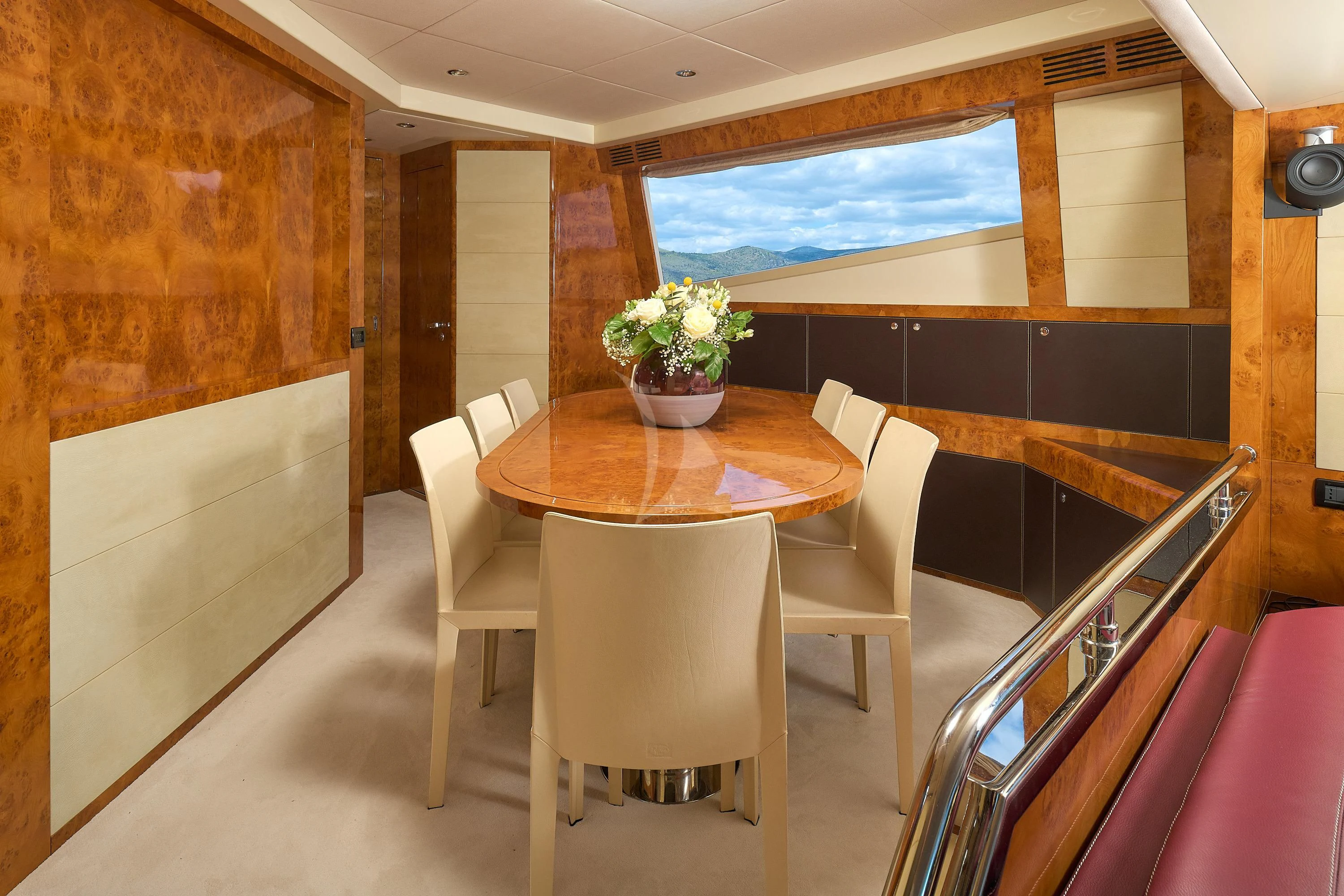 a room with a table and chairs aboard 888 Yacht for Sale