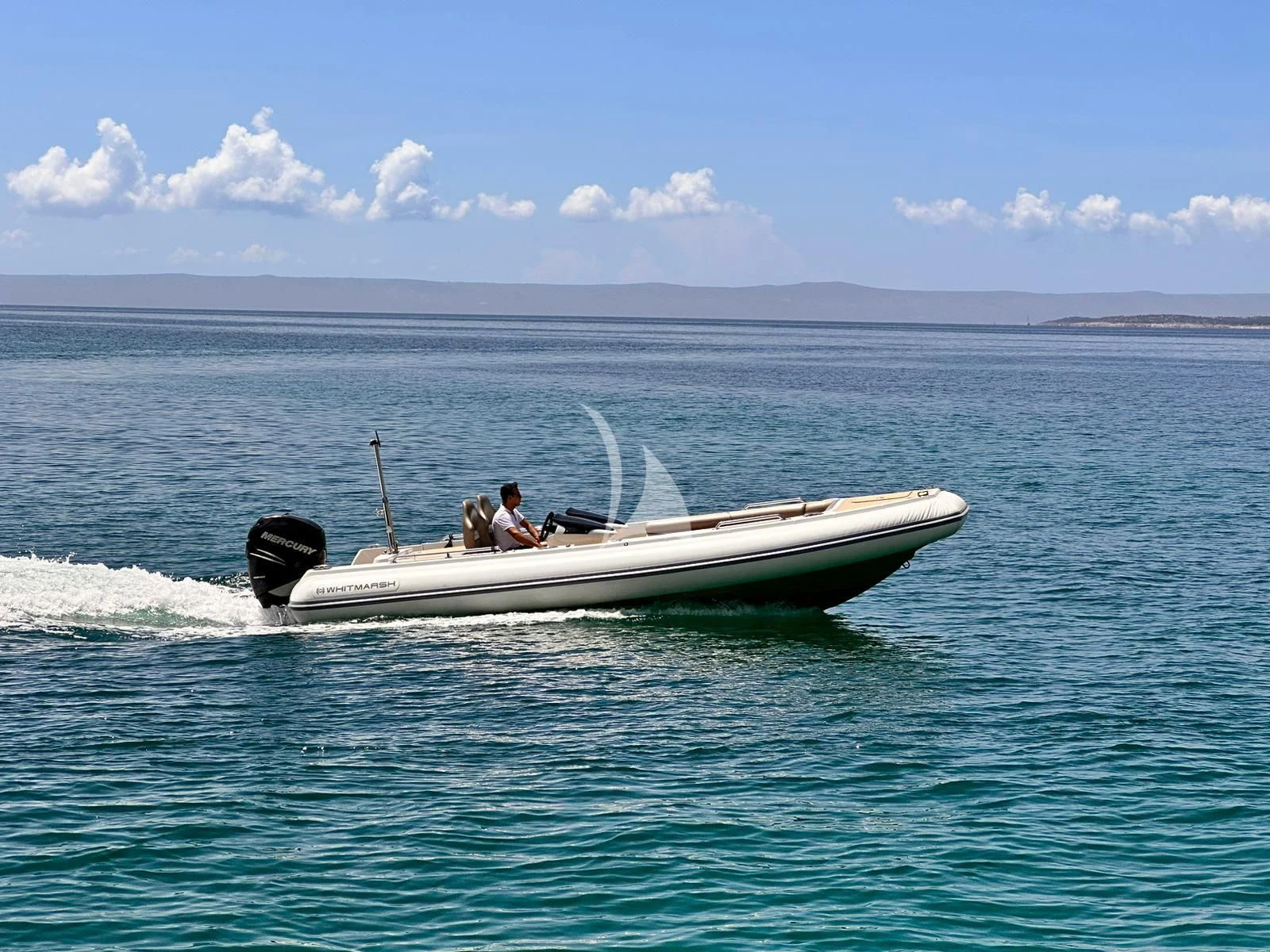 a boat with a motor in the water aboard 888 Yacht for Sale