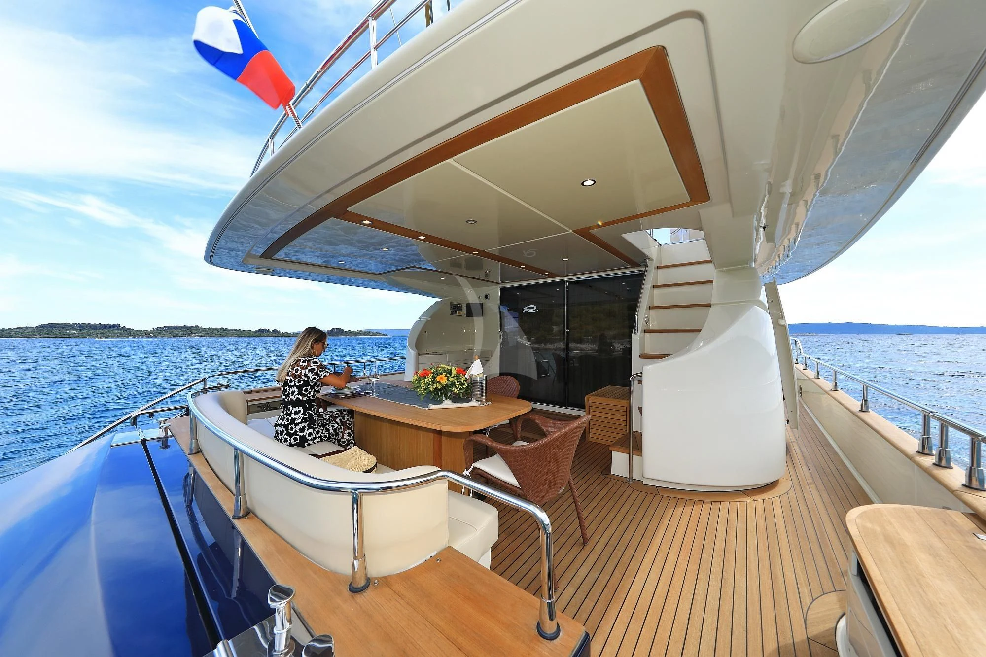 a person sitting on a boat aboard 888 Yacht for Sale