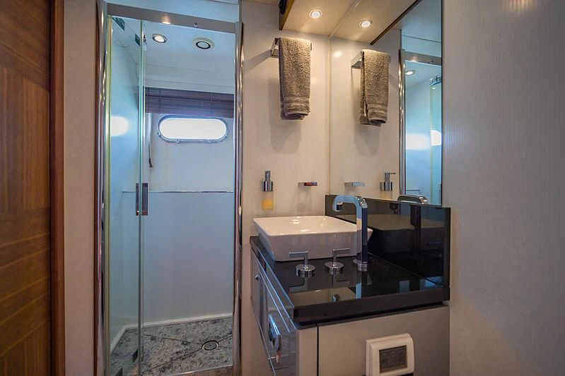 a bathroom with a glass shower aboard SYDNEY Yacht for Charter