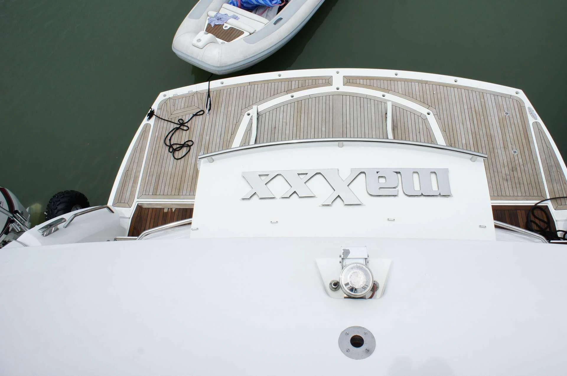 a white bed with a white sheet aboard SYDNEY Yacht for Charter