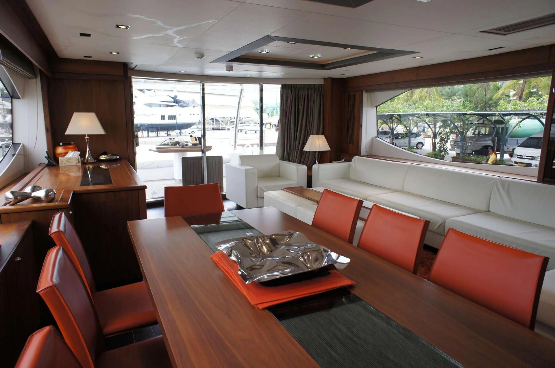 a living room with a large window aboard SYDNEY Yacht for Charter