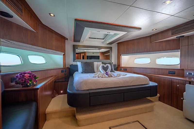 a room with a bed and a desk aboard SYDNEY Yacht for Charter