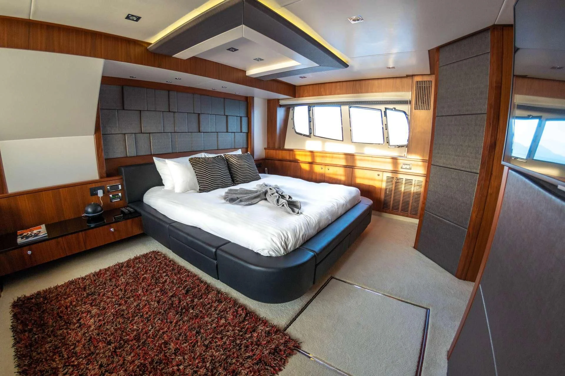 a large bedroom with a large bed aboard SYDNEY Yacht for Charter