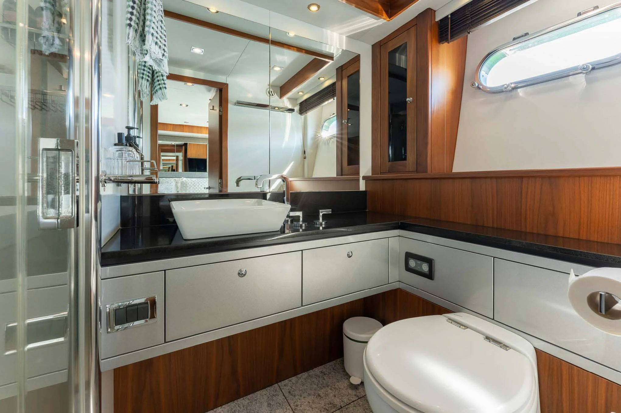 a bathroom with a sink and toilet aboard SYDNEY Yacht for Charter