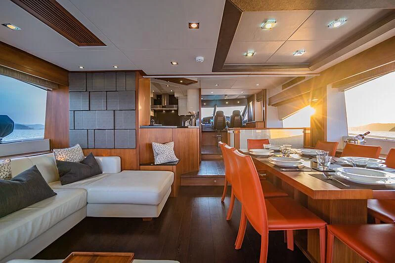 a living room with a couch and a table aboard SYDNEY Yacht for Charter