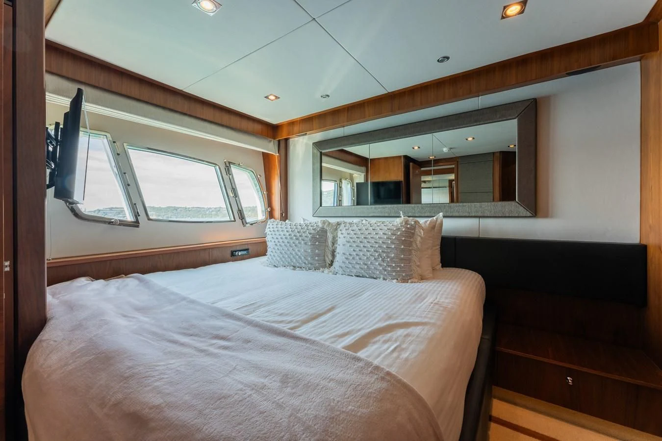 a bed in a room aboard SYDNEY Yacht for Charter