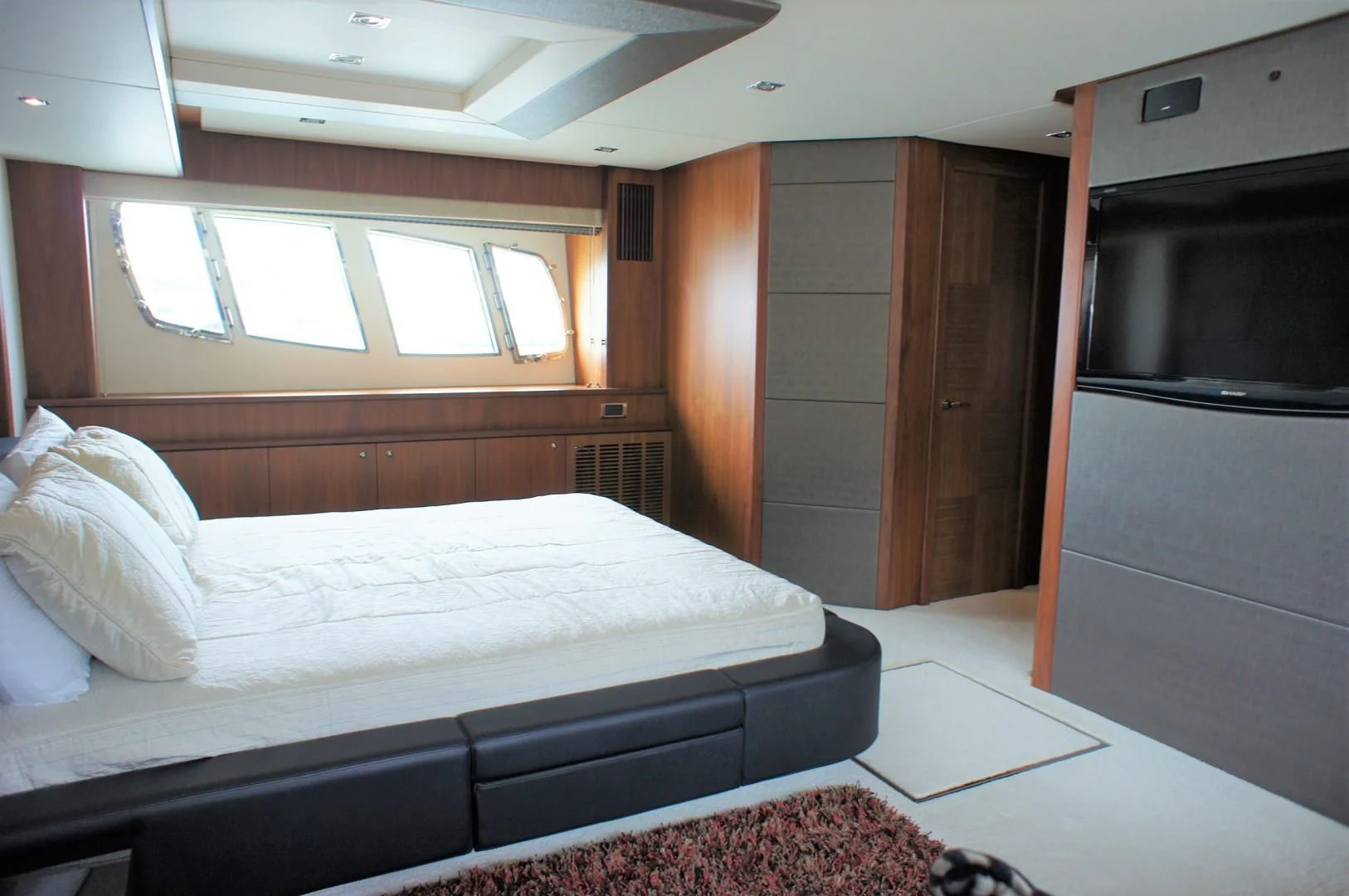 a bed in a room aboard SYDNEY Yacht for Charter