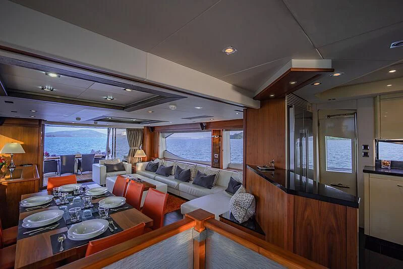 a living room with a large window aboard SYDNEY Yacht for Charter