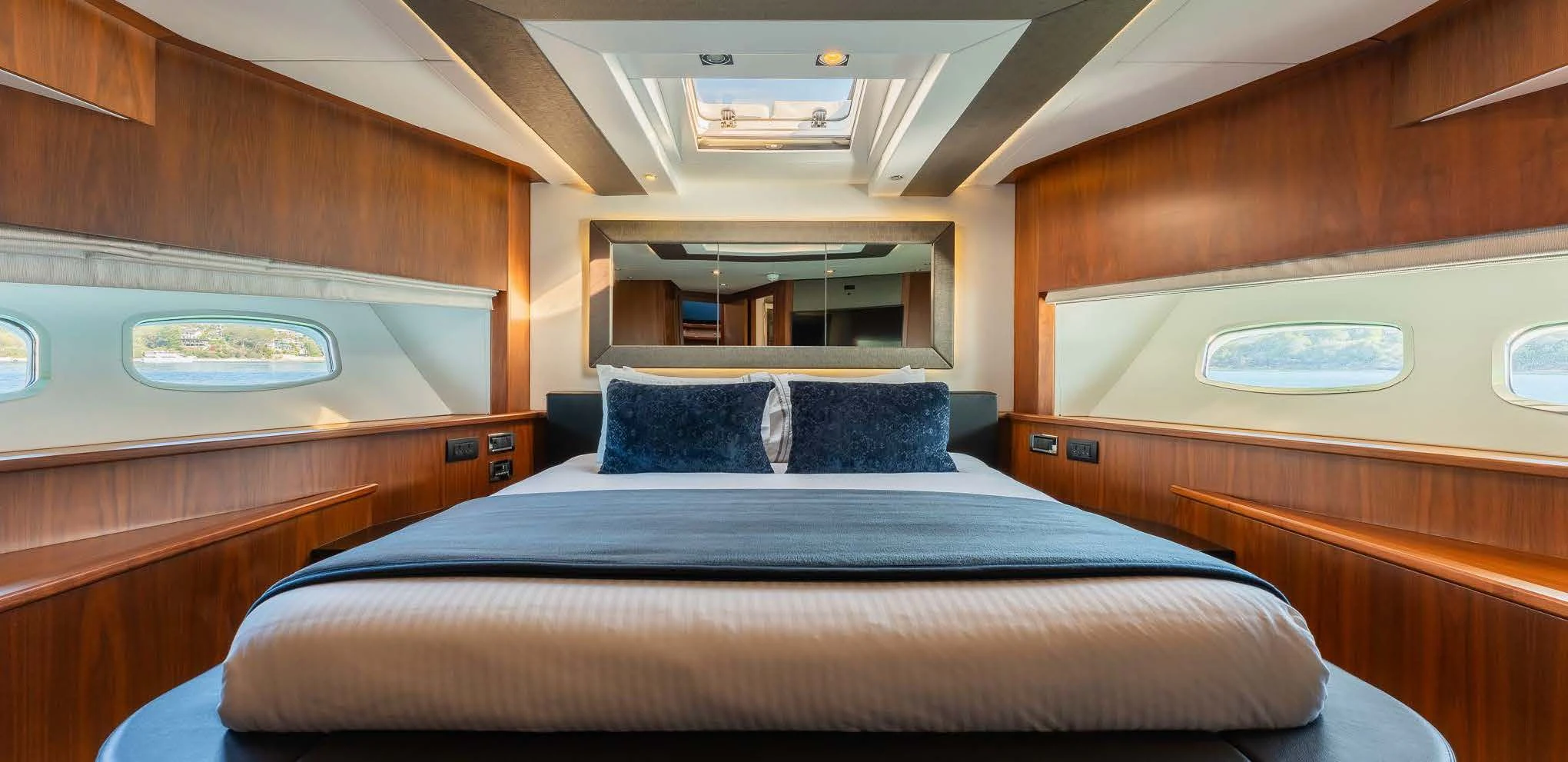 a bed in a room aboard SYDNEY Yacht for Charter