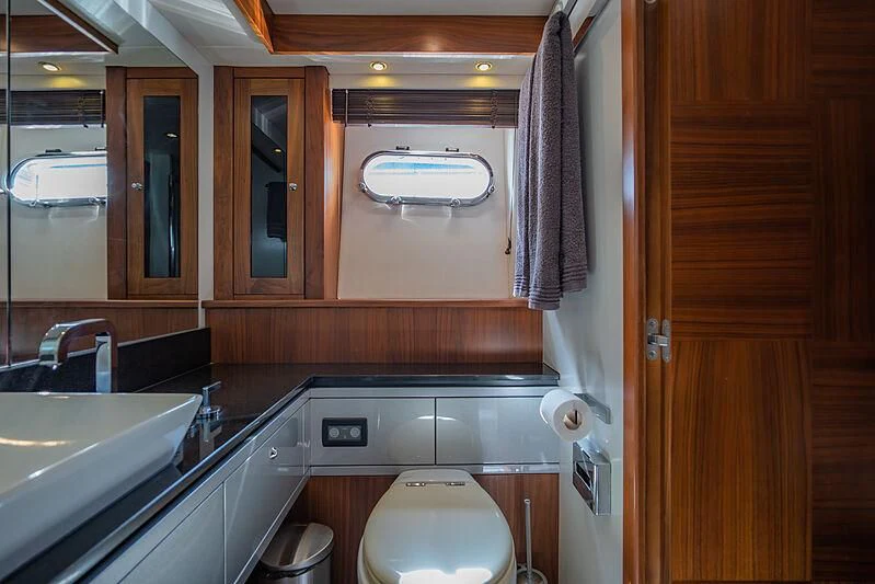 a bathroom with a sink and a toilet aboard SYDNEY Yacht for Charter
