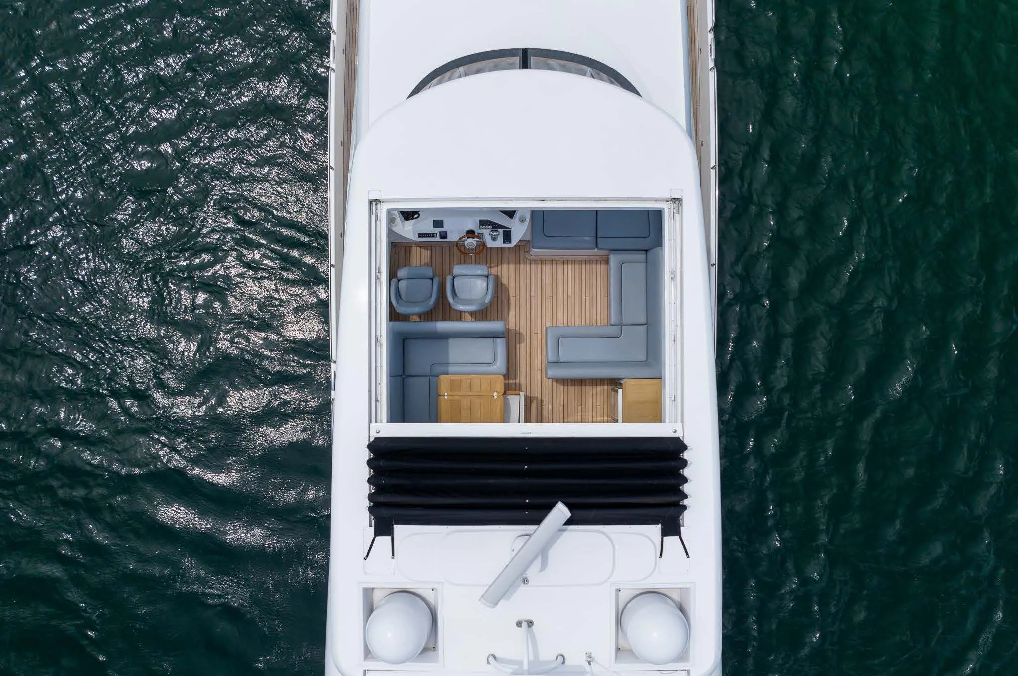 a white microwave oven and a green curtain aboard SYDNEY Yacht for Charter