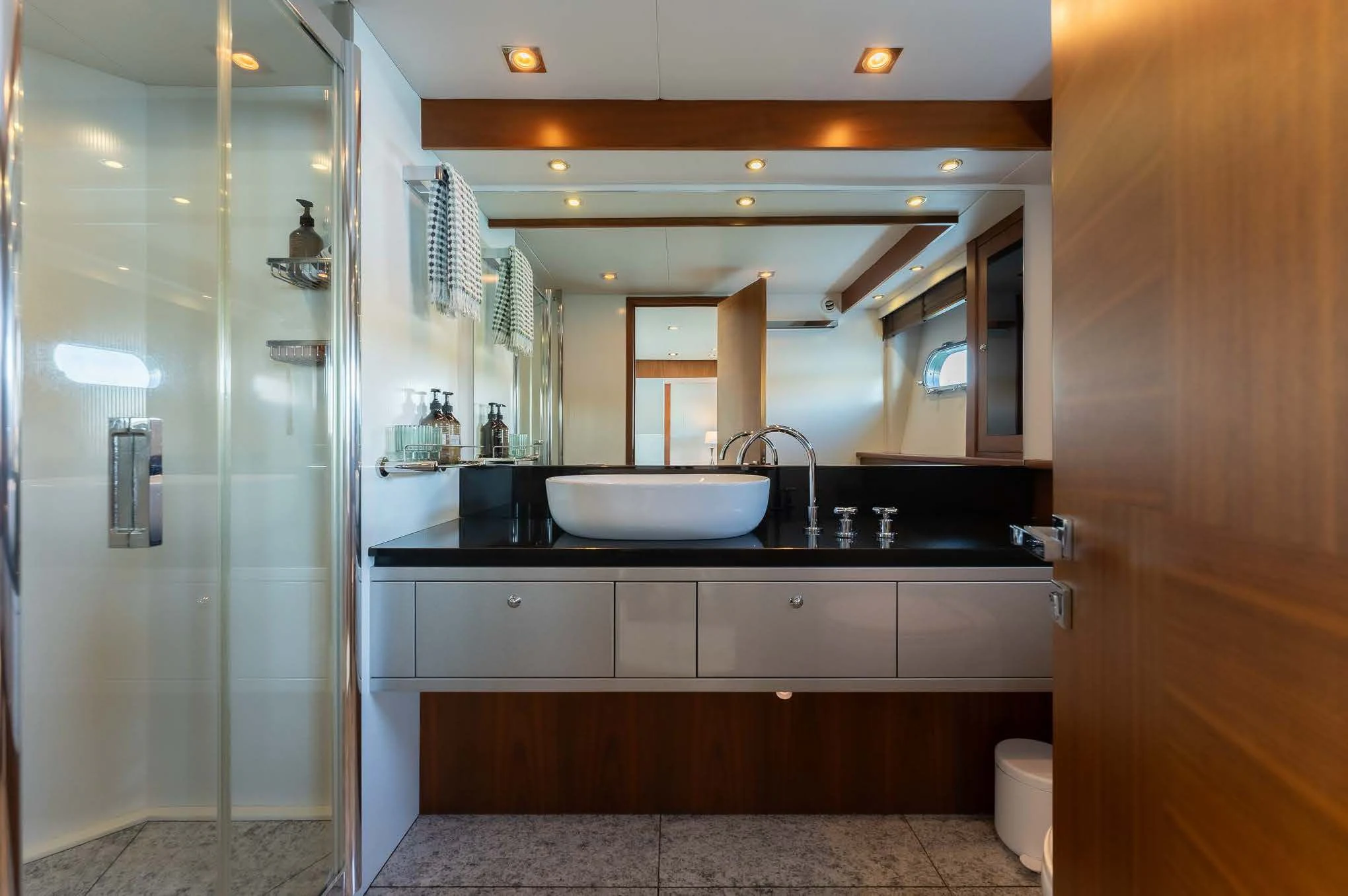 a bathroom with a glass shower aboard SYDNEY Yacht for Charter