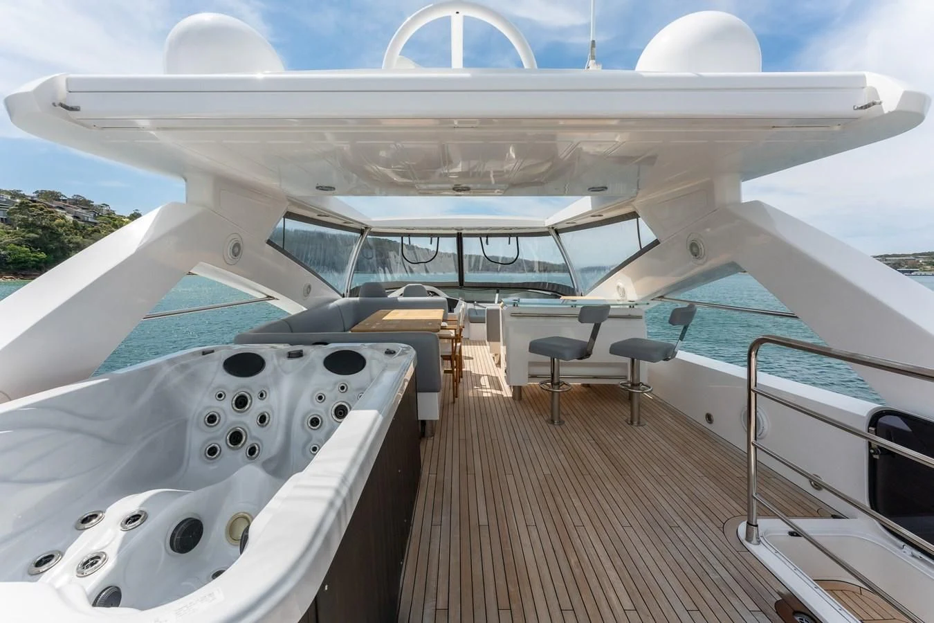 a deck with a large yacht aboard SYDNEY Yacht for Charter