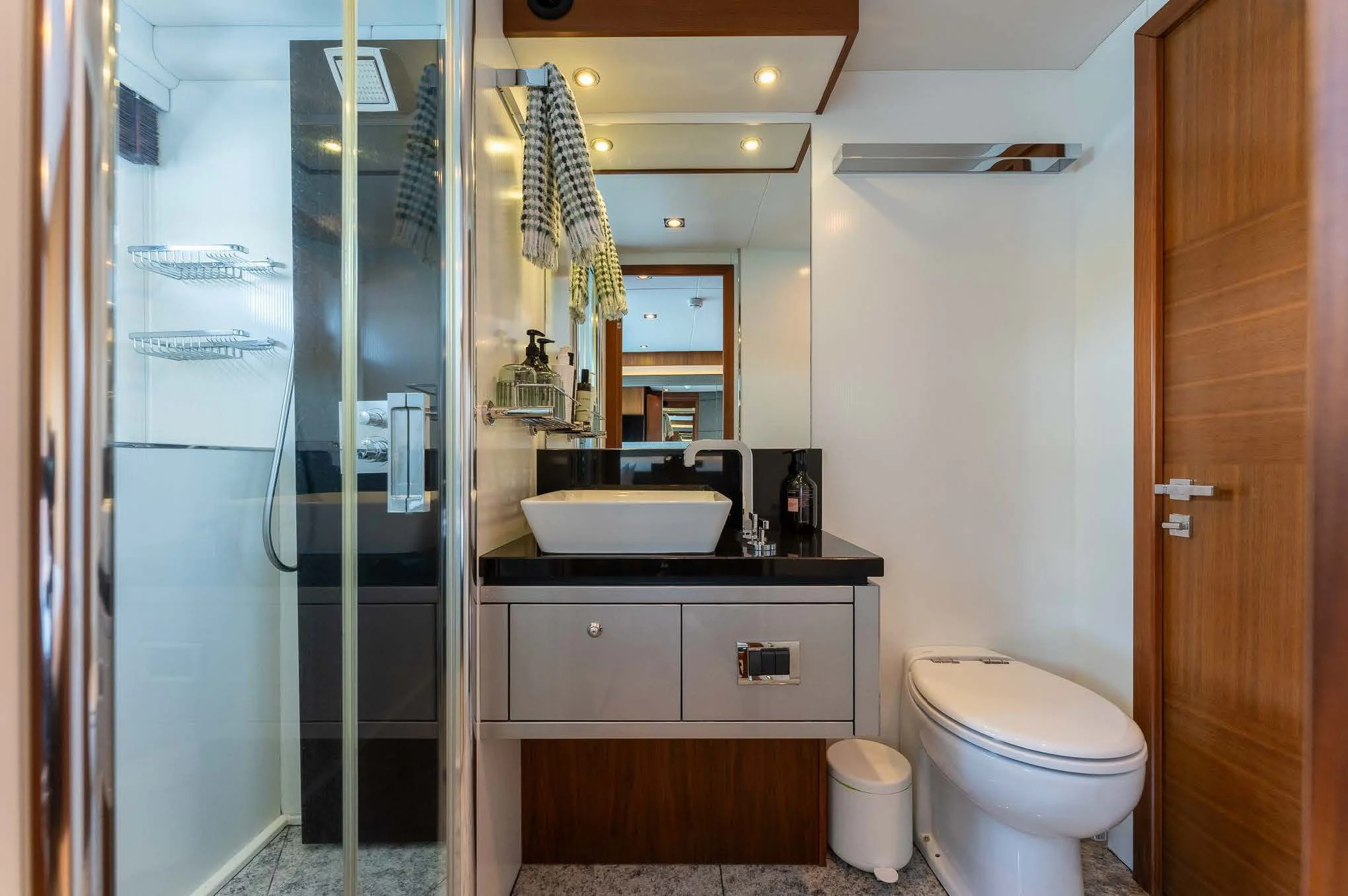 a bathroom with a glass shower aboard SYDNEY Yacht for Charter