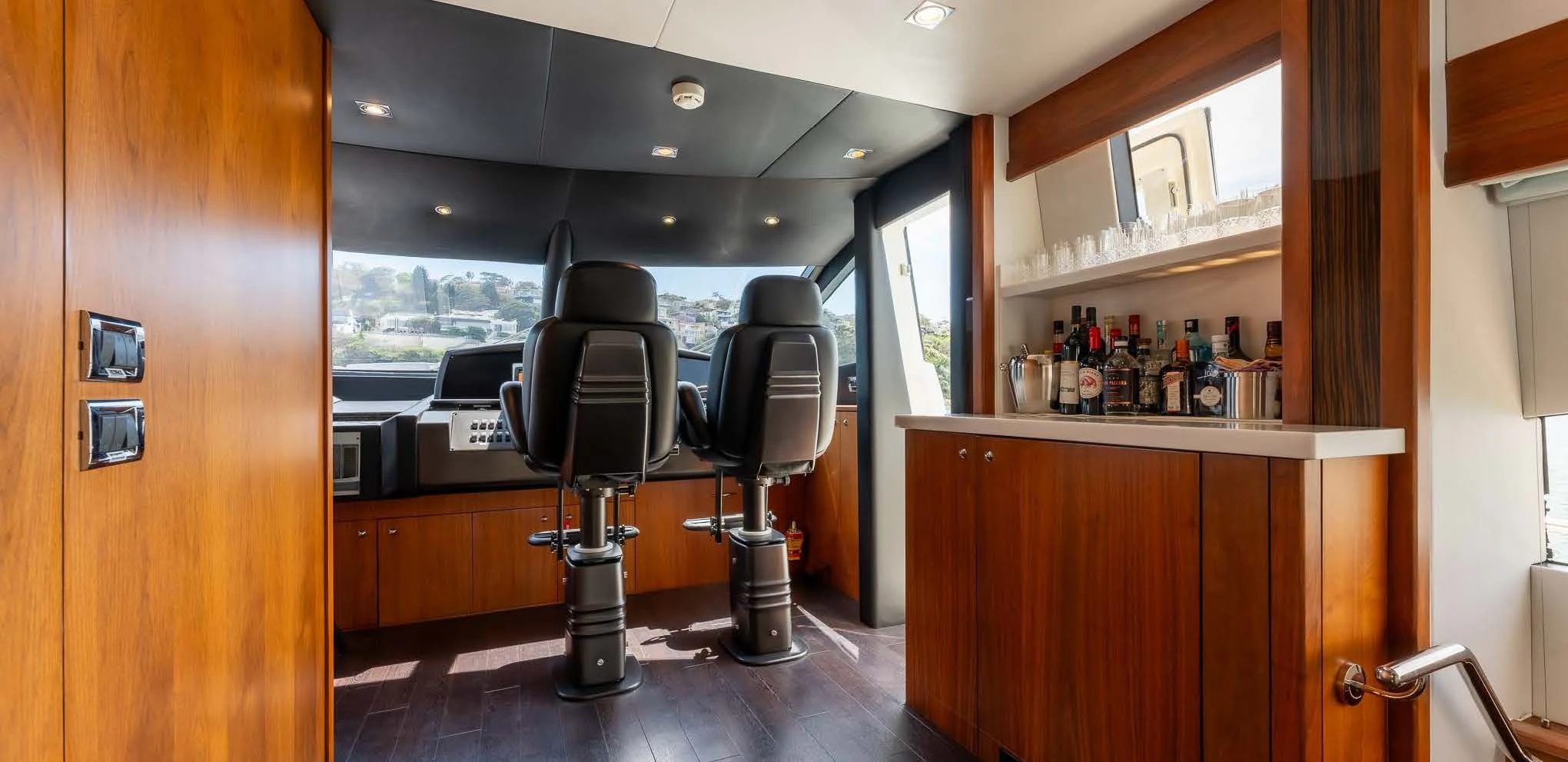 a bar stool next to a bar aboard SYDNEY Yacht for Charter