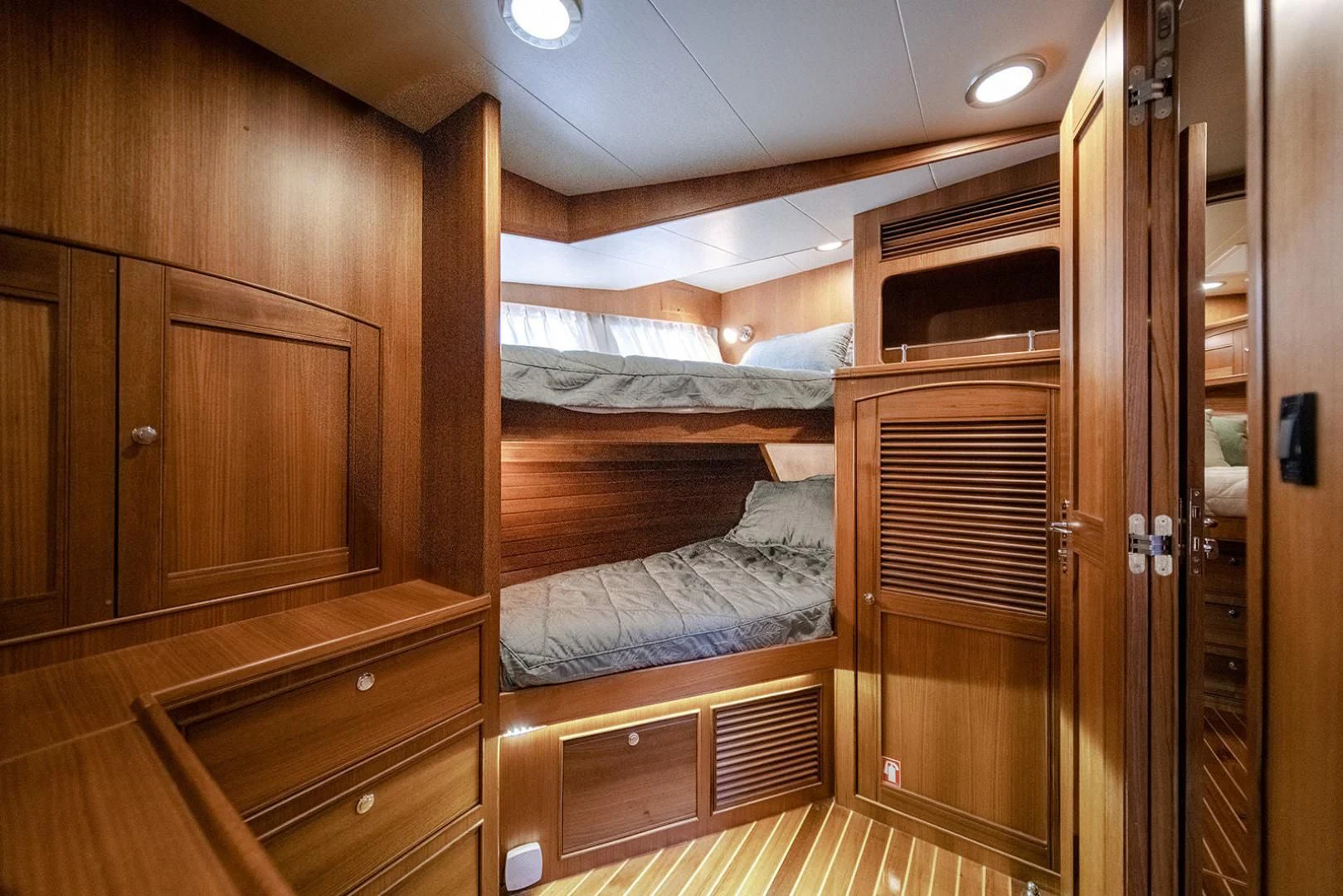 a room with wooden cabinets aboard EASYWAY Yacht for Sale