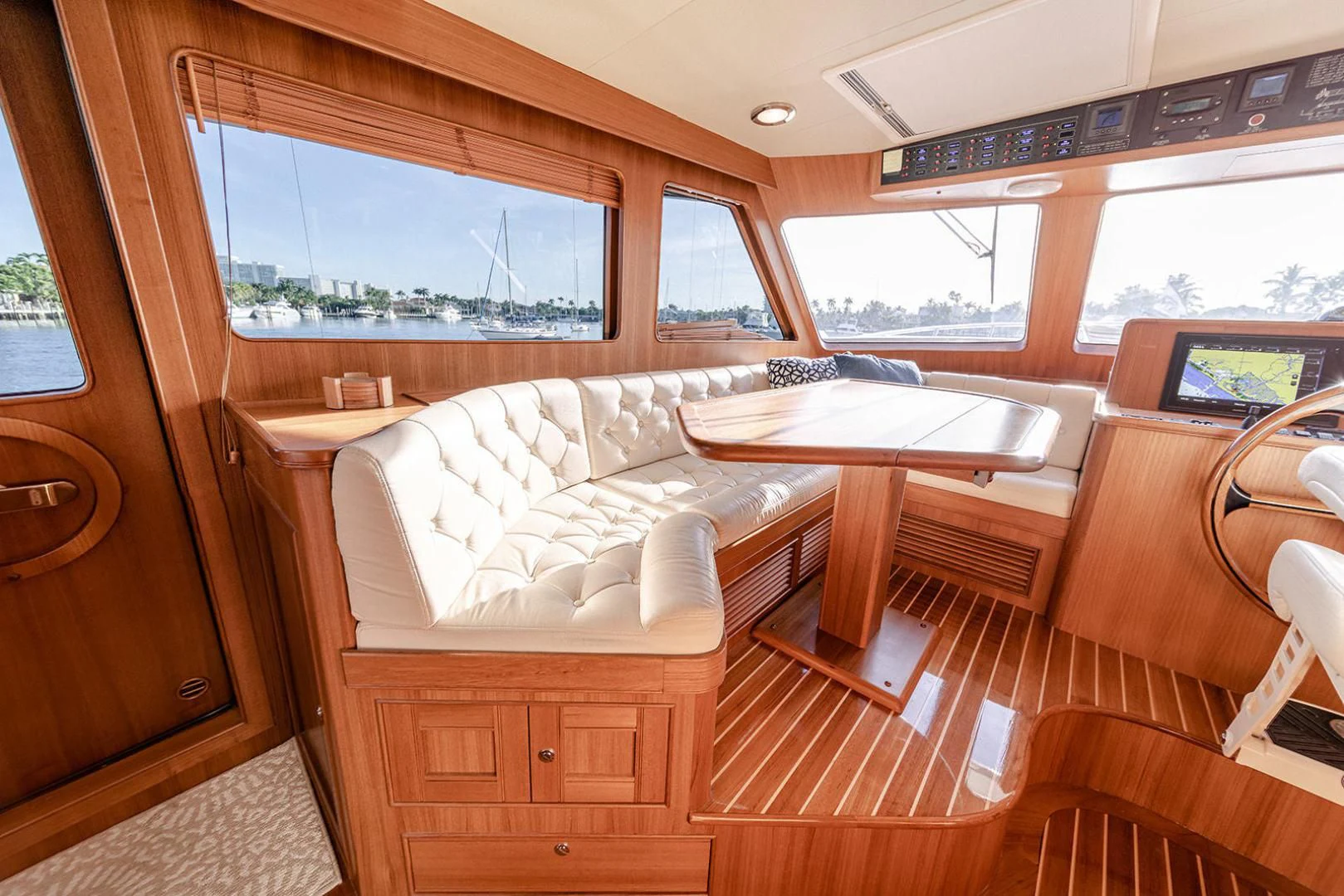 a room with a bed and a table aboard EASYWAY Yacht for Sale