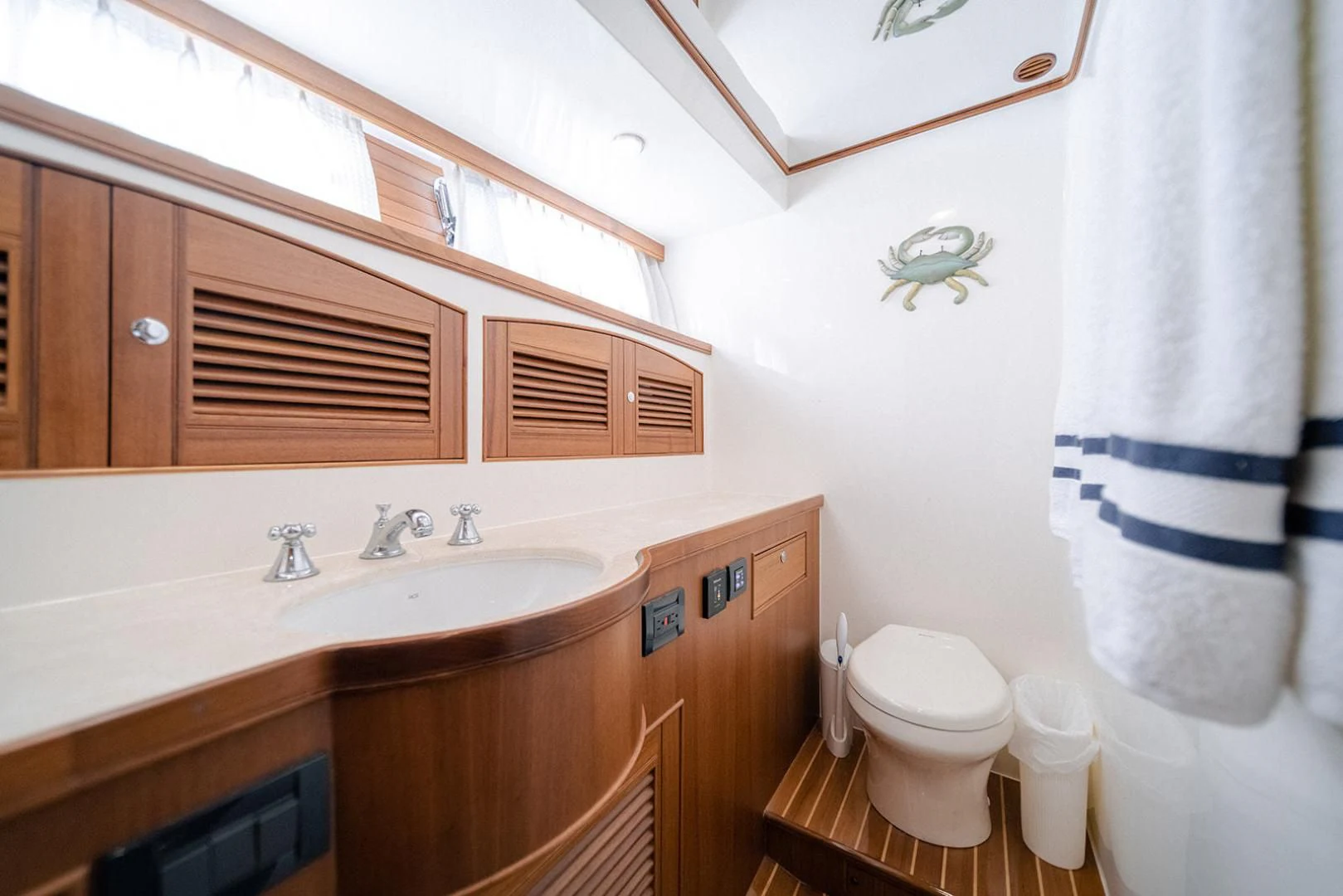 a bathroom with a sink and a toilet aboard EASYWAY Yacht for Sale