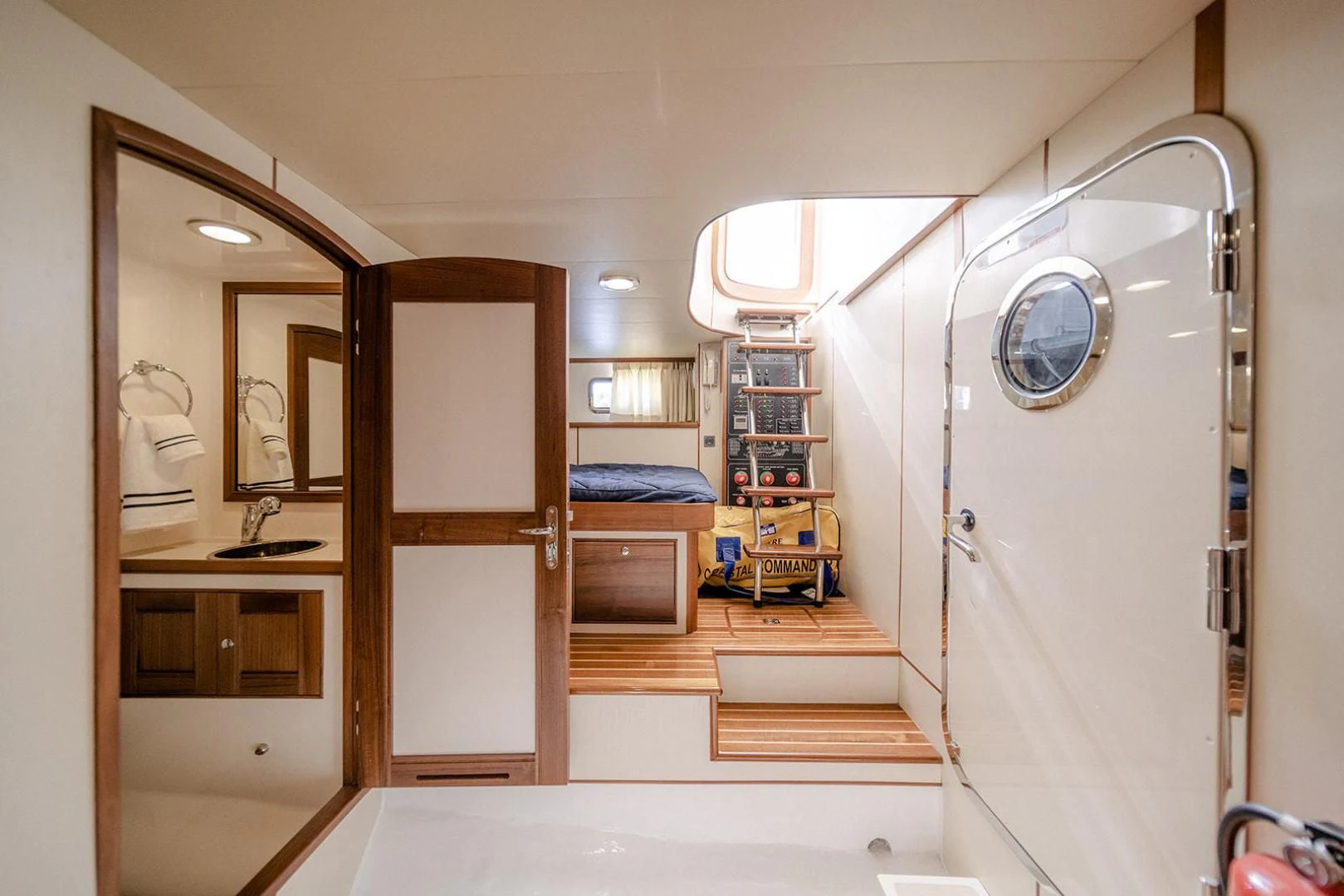 a room with a bed and a mirror aboard EASYWAY Yacht for Sale