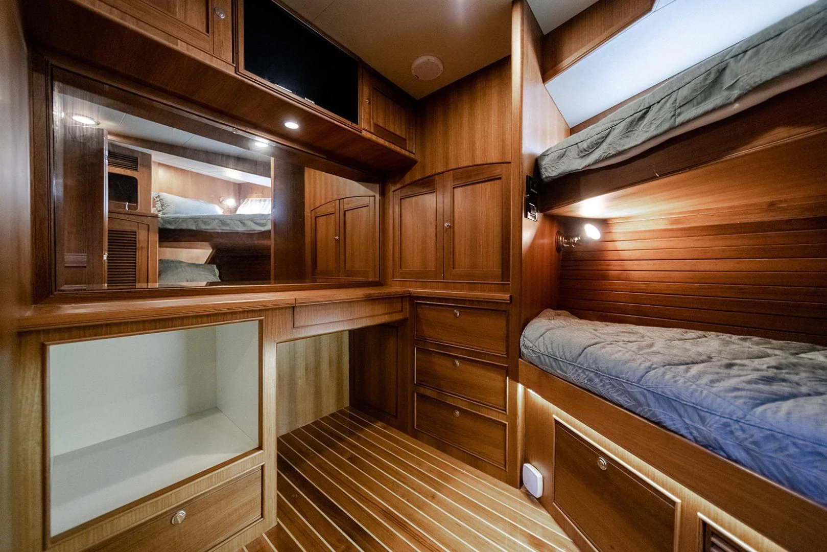 a room with wooden furniture aboard EASYWAY Yacht for Sale