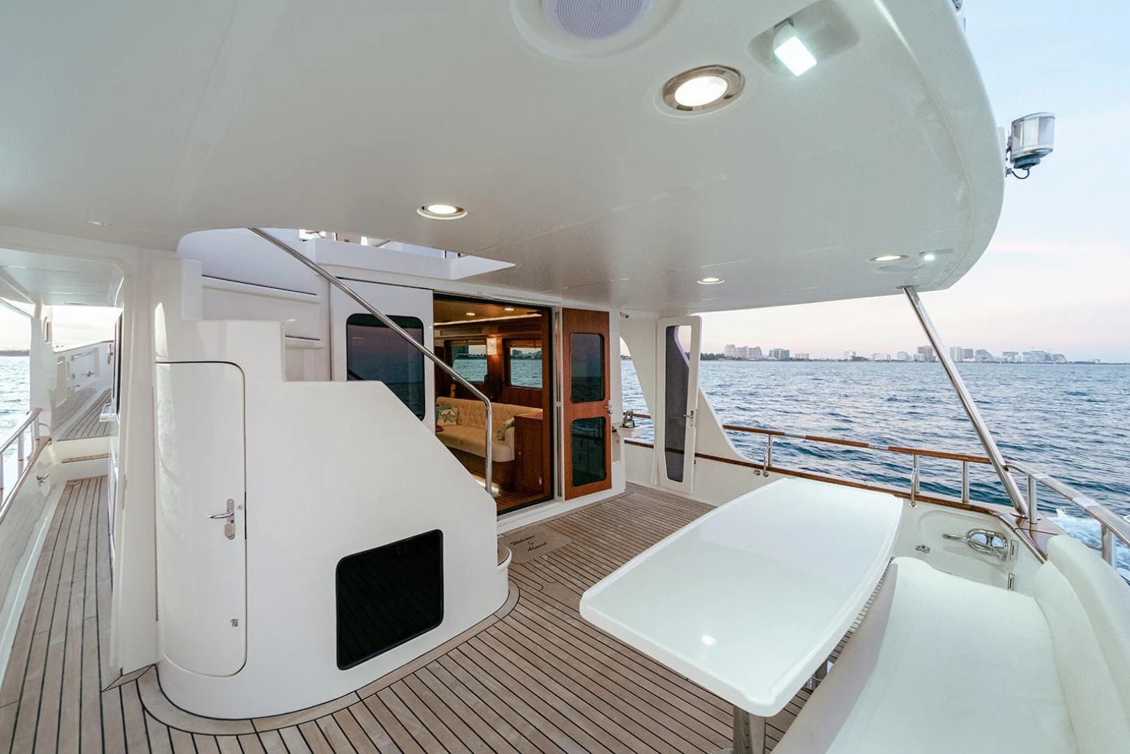 a large white room with a large pool and a large balcony aboard EASYWAY Yacht for Sale