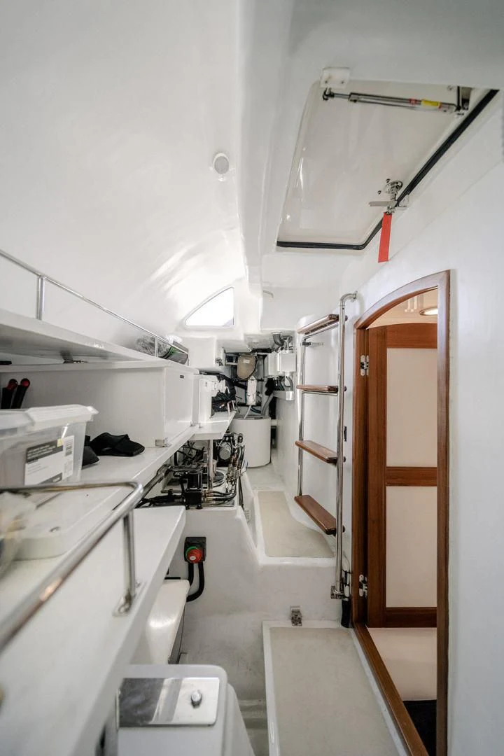 a room with a white counter and a wooden door aboard EASYWAY Yacht for Sale