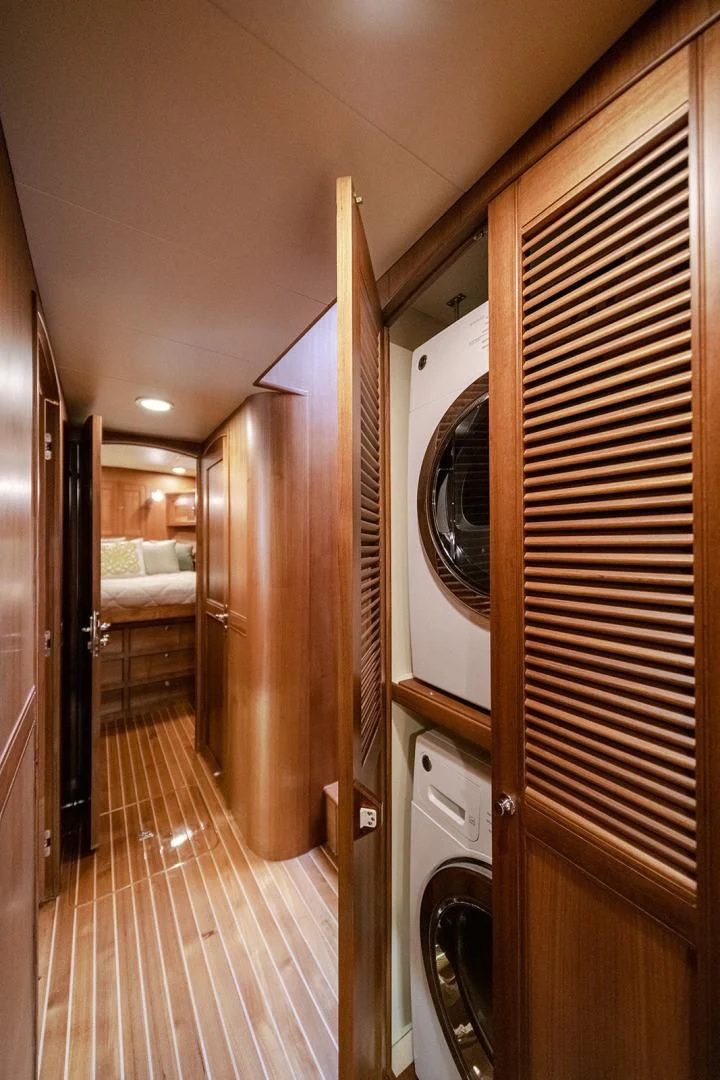 a hallway with a washing machine aboard EASYWAY Yacht for Sale
