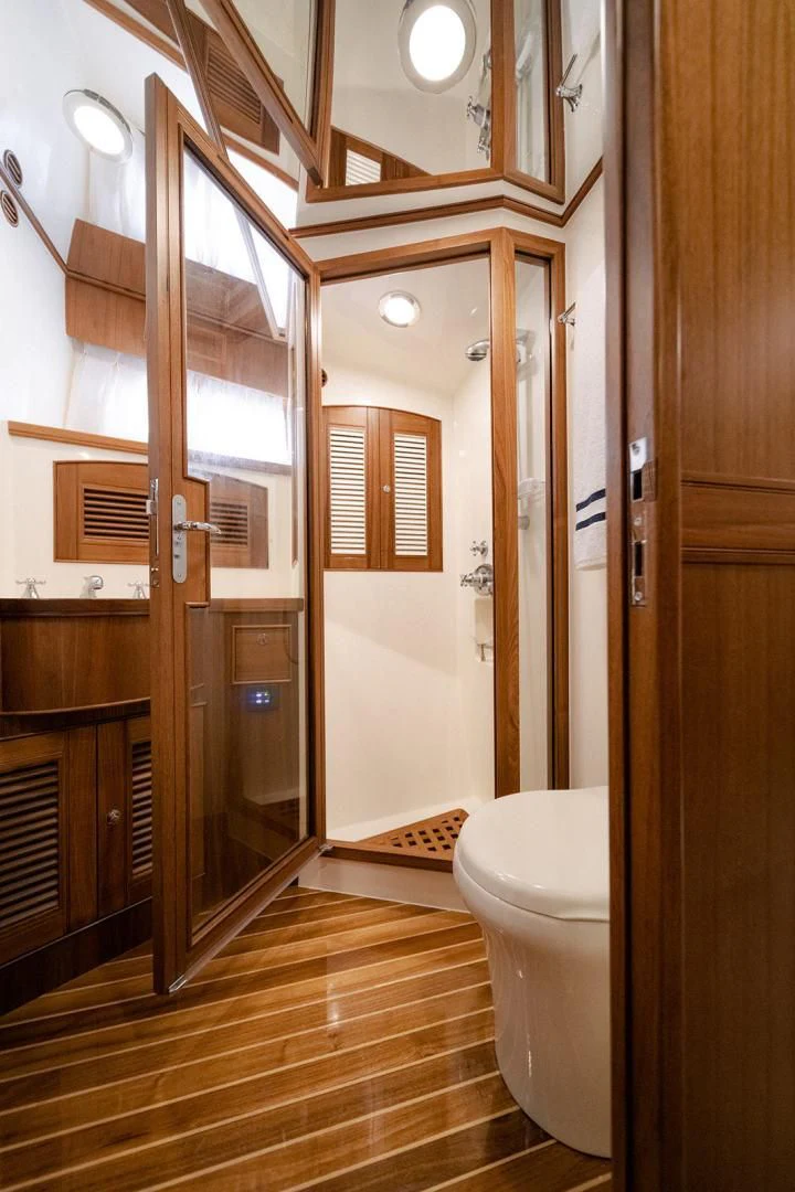 a bathroom with a glass shower aboard EASYWAY Yacht for Sale