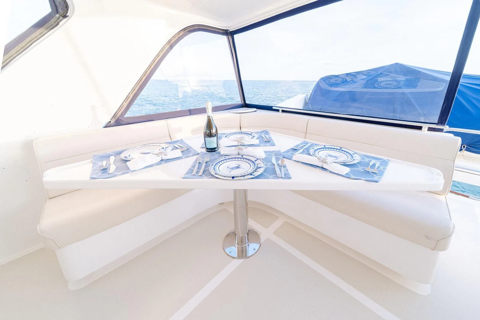 a white table with a glass window aboard EASYWAY Yacht for Sale