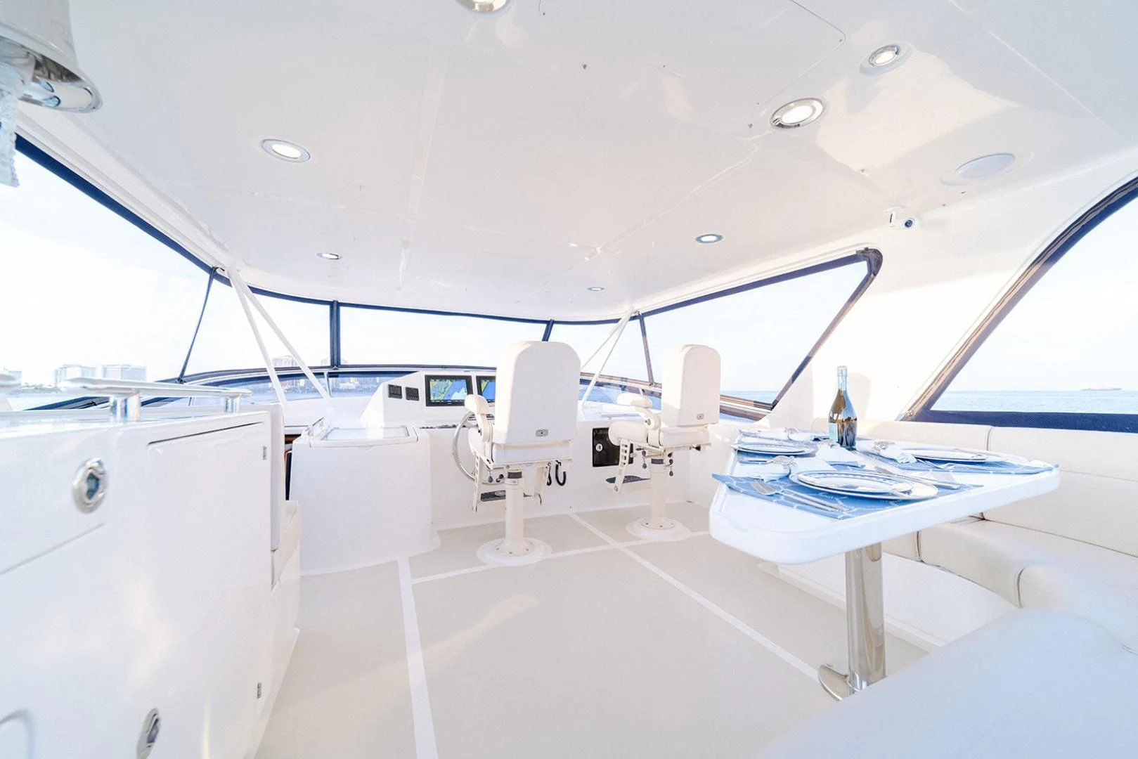 a room with a table and chairs aboard EASYWAY Yacht for Sale