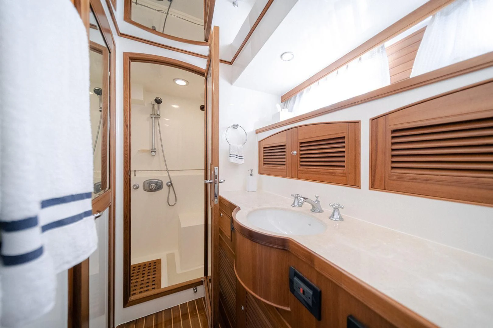 a bathroom with a sink and a mirror aboard EASYWAY Yacht for Sale