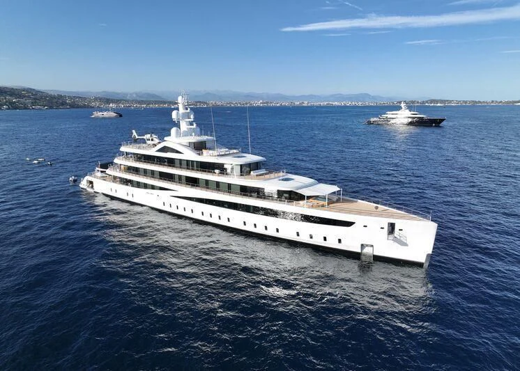 a large white ship in the water aboard DEFY Yacht for Sale
