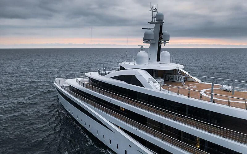 a large ship in the water aboard DEFY Yacht for Sale