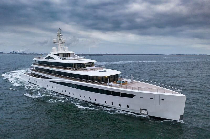 a large white ship in the water aboard DEFY Yacht for Sale