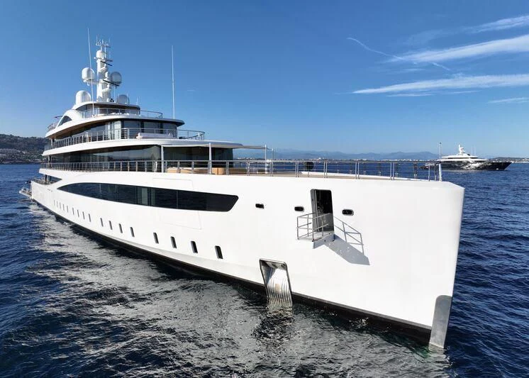 a large white ship in the water aboard DEFY Yacht for Sale