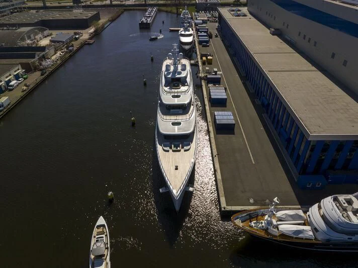 a large ship in the water aboard DEFY Yacht for Sale