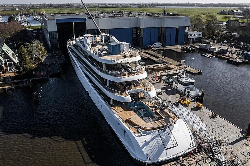 a large ship docked aboard DEFY Yacht for Sale