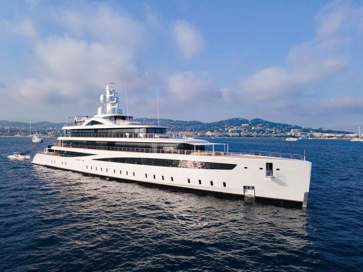 a large white yacht in the water aboard DEFY Yacht for Sale