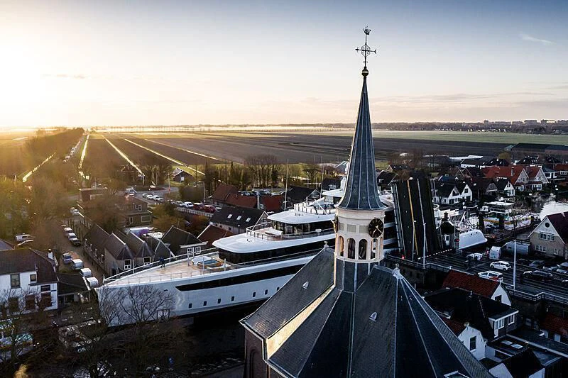 a large building with a tower aboard DEFY Yacht for Sale