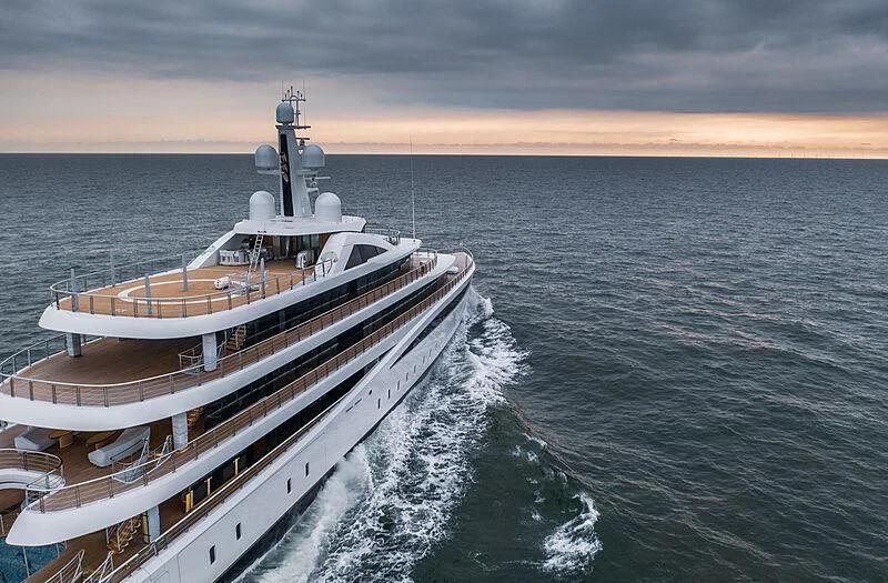 a large ship in the water aboard DEFY Yacht for Sale