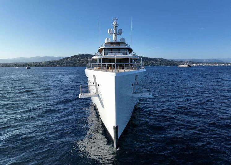 a large white boat in the water aboard DEFY Yacht for Sale